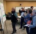 Group of people looking at boards