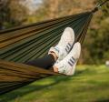 teen lounging in hammock