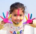 girl with fingerpaint on her hands