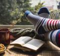 photo of book and socked feet