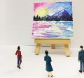 tiny painting on wooden easel being viewed by small human figures
