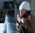 Woman wearing jacket and hat indoors