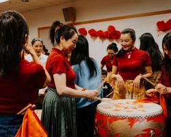 Ladies playing the drums at Lunar New Year event