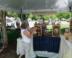 pottery booth with customer