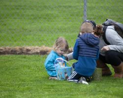 family picking up eggs