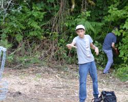 boy throwing disc golf