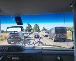 Bikes on the front of bus in traffic seen by driver