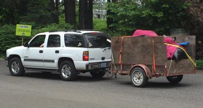 Truck hauling trailer full of waste