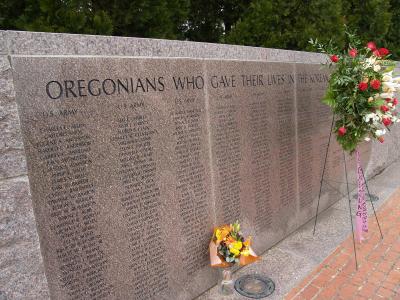 Memorial Wall, with flowers