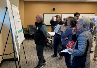 Group of people looking at boards