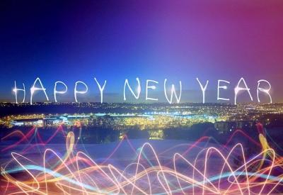"Happy New Year" text and fireworks