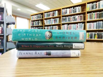 stack of books forming a poem with the titles on the spines