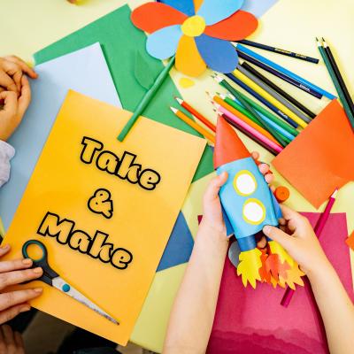 text of words "take & make" with photo of craft tabletop, paper, scissors, colored pencils, and finished crafts