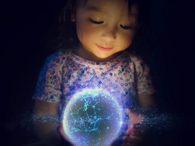 child holding an electric globe