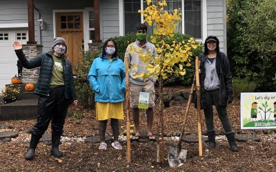 Volunteers after planting a tree at a 2001 event