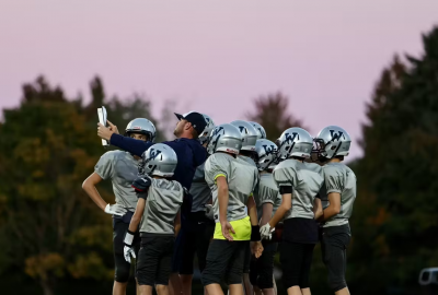 wilsonville football players huddled