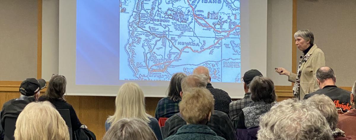Charlotte Lehan delivers a lecture at the Library
