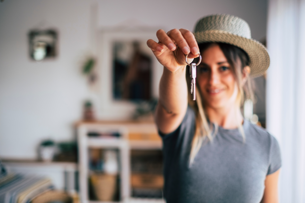 Renter holding her keys out to the camera.