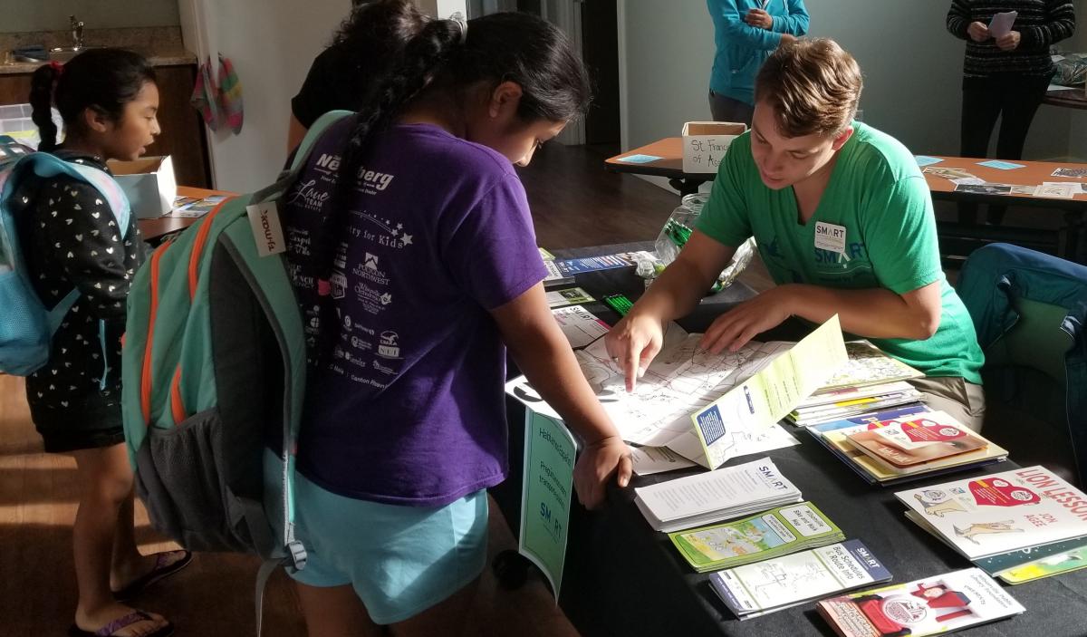 Intern explaining a map