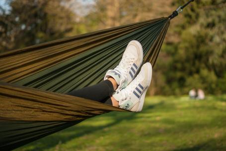 teen lounging in hammock