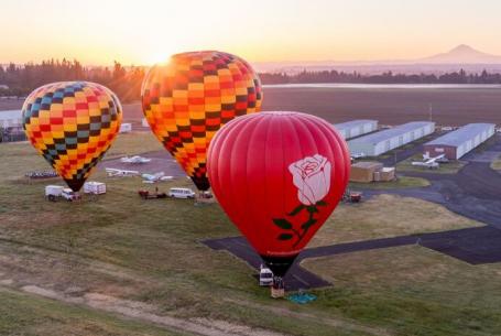 hot air balloons inflated at airport