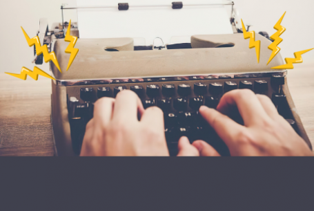 person typing on a typewriter