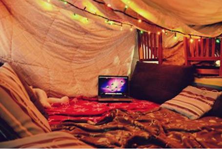 cozy tent with blankets and pillows