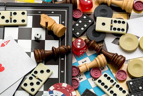 game board pieces and cards and dice