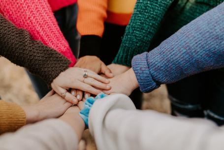 staff clasping hands