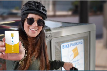 Female holding bike link card