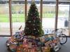 New, unwrapped toys under holiday tree