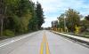A new segment of Garden Acres Rd. includes a sidewalk offset from the roadway.