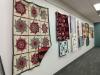 Art Gallery wall with quilts displayed