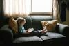 girl reading on couch